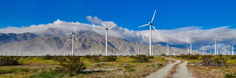 Panoramic view of road by mountains against sky