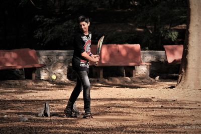 Full length of boy standing on land