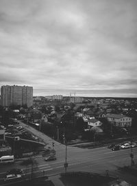 View of cityscape against cloudy sky