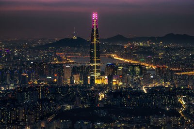 Illuminated buildings in city at night