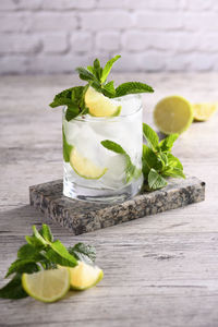 Refreshing summer alcoholic cocktail mojito with ice, fresh mint and lime