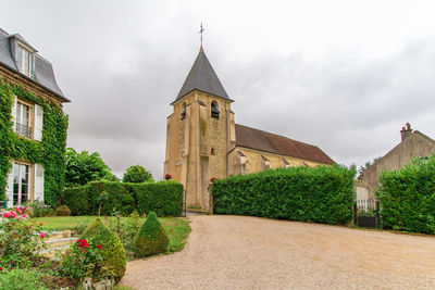 Panoramic view of temple and building against sky