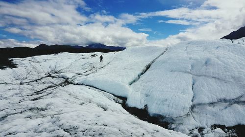 Scenic view of snow covered mountains against sky