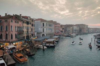 High angle view of boats on grand canal during sunset in city