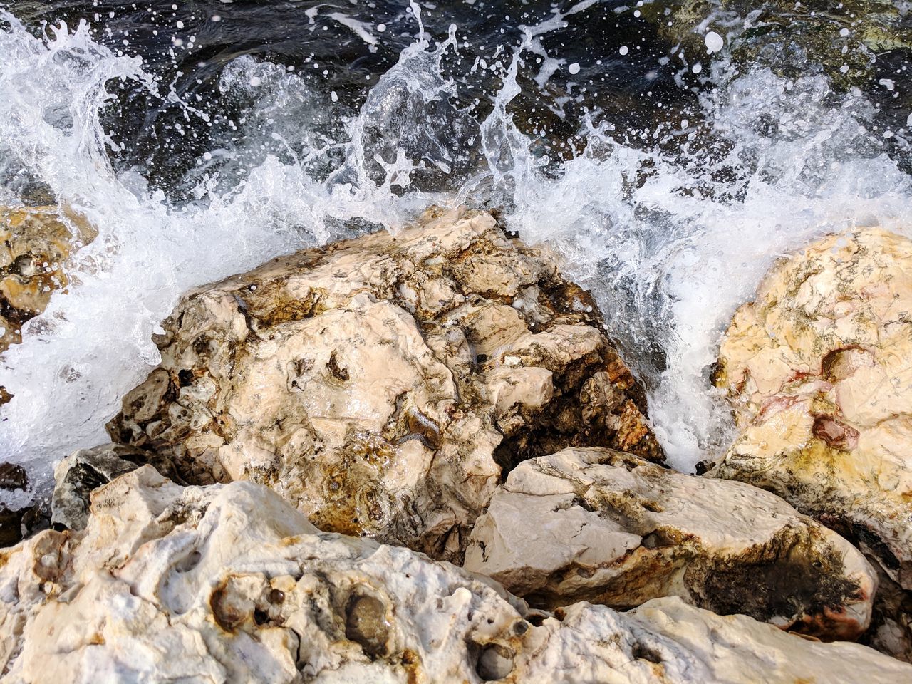 SCENIC VIEW OF ROCKS IN SEA