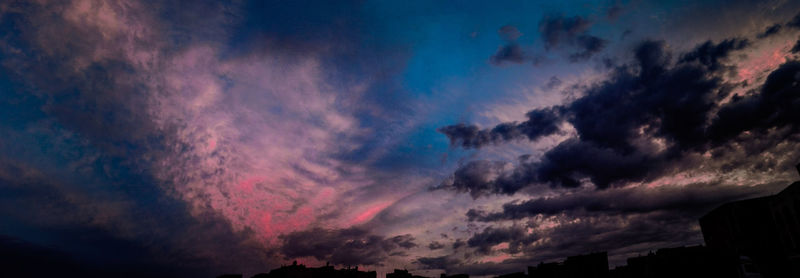 Low angle view of dramatic sky during sunset