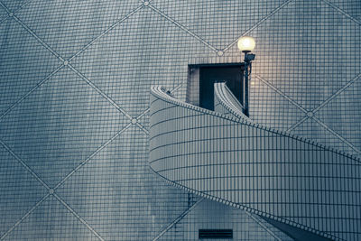 Low angle view of illuminated staircase against building