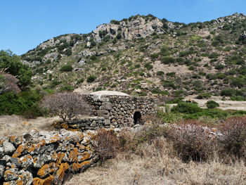 View of rocks on land against clear sky