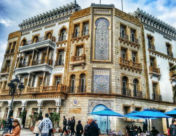 Tourists in front of building