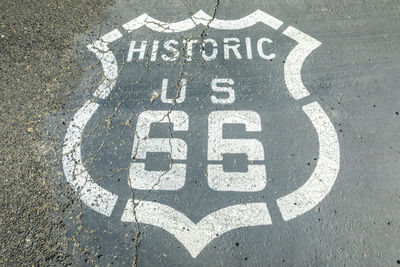 High angle view of road sign on street