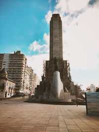 Low angle view of historical building against cloudy sky