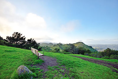 Bench on countryside landscape