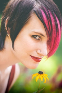 Close-up portrait of woman with dyed hair