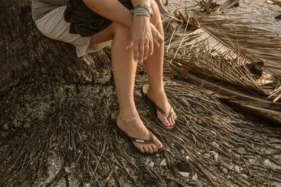 Low section of woman with arms raised