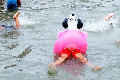 High angle view of woman swimming in sea