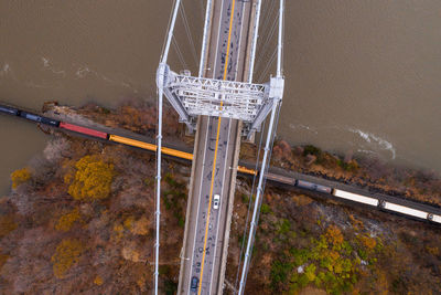 High angle view of bridge over road against mountain