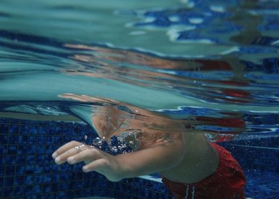 Reflection of woman in water