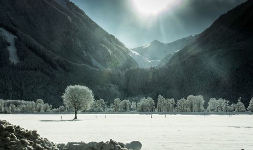 Scenic view of frozen lake against mountains