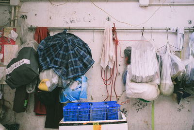 Objects hanging from rack against wall at home