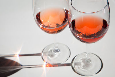 Close-up of red and rosè wine in two glasses on table