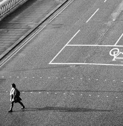 High angle view of people walking on road