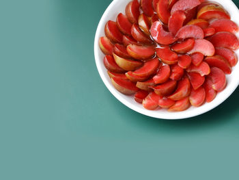 High angle view of strawberries in bowl on table