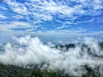 Scenic view of waterfall against sky