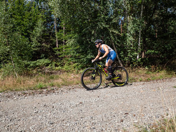 Man riding bicycle on road