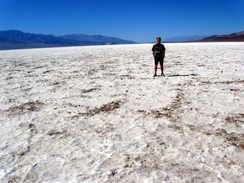 Man standing at badwater basin in death valley national park