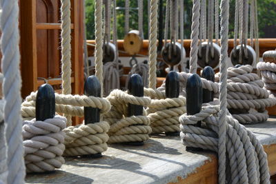 Close-up of ropes tied on wood