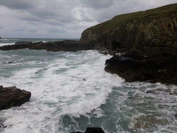 Scenic view of sea against cloudy sky