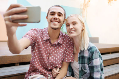 Portrait of young woman using mobile phone