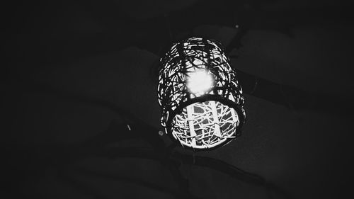 Low angle view of illuminated lights at night