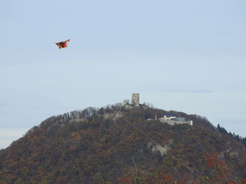 Low angle view of kite flying against clear sky