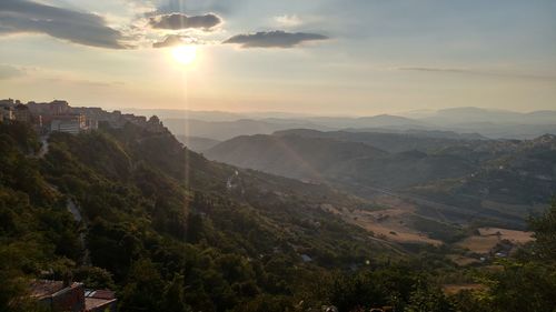 Scenic view of landscape against sky during sunset