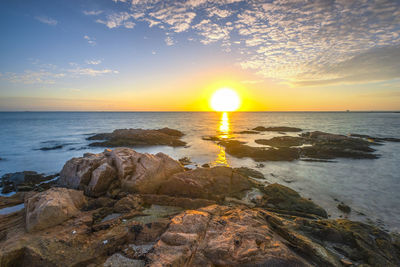 Scenic view of sea against sky during sunset