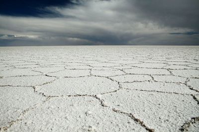 Scenic view of salt flat at salar de uyuni against sky