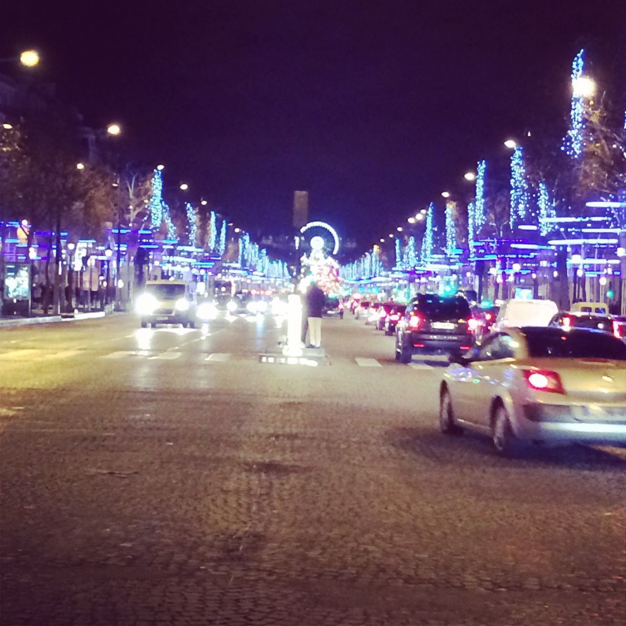 night, illuminated, architecture, city, building exterior, transportation, built structure, car, street, land vehicle, road, street light, city street, mode of transport, city life, traffic, the way forward, lighting equipment, light trail, outdoors