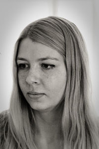 Close-up of young woman with long blond hair