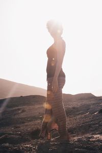 Full length of man standing on land against sky