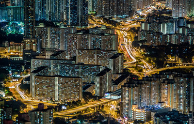 High angle view of city lit up at night