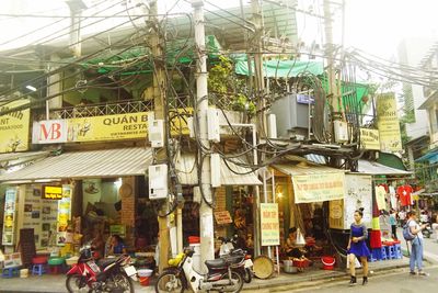 People in city against sky