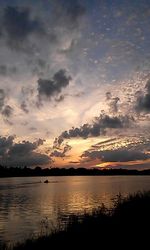 Scenic view of lake at sunset