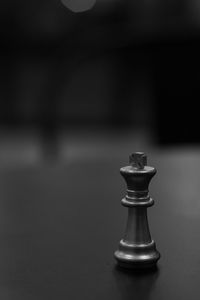 Close-up of chess pieces on table