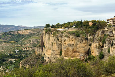 Scenic view of landscape against cloudy sky