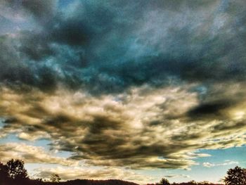 Low angle view of dramatic sky during sunset