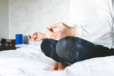 Midsection of man using mobile phone