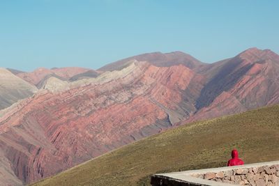 Scenic view of mountain range against blue sky