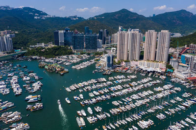 High angle view of buildings by sea in city