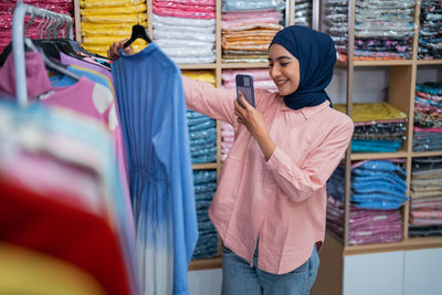 Rear view of woman standing in store